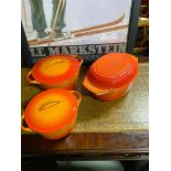 A Selection of Le crueset cooking pots, tureens with lids and frying pans.