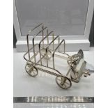 An unusual silver plated toast rack in the form of a vintage car. Stamped to the inside.