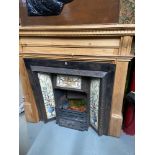 Antique cast iron and tile design fire insert together with a solid pine fire surround.