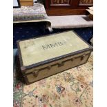 A Vintage canvas and brass bound travel trunk