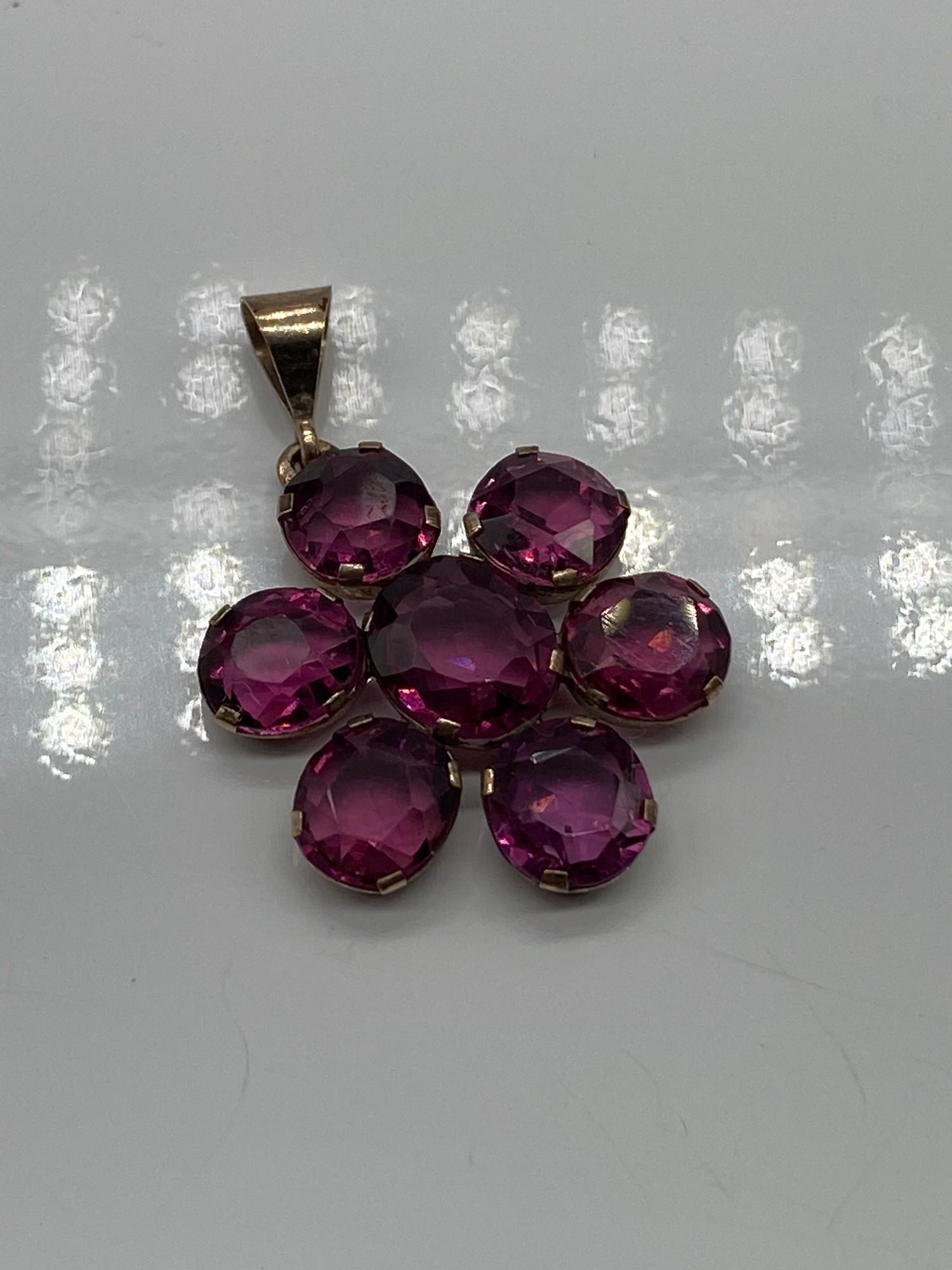 A Beautiful example of an Antique yellow metal and Amethyst pendant.