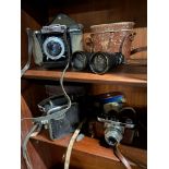 A Lot of three vintage cameras and a pair of field binoculars with case. Cameras consist of
