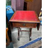 A Reproduction antique style drop end side table with leather top. Designed with pedestal supports