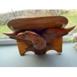 An antique hand carved Black Forest style Eagle design wall shelf. [A/F] [42CM wide]