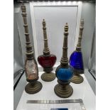 A Lot of four vintage perfume bottles all designed with plated panels, stands and funnels