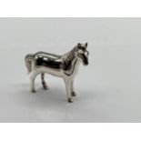 A 925 Sterling Silver figure of a horse. [4cm in length]
