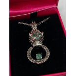 A 925 Silver Cartier style pendant and necklace, The pendant is designed with semi precious stones.