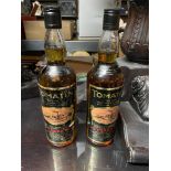 Two Bottlings of Tomatin fine old Highland Malt Scotch Whisky. Both 10 Years old.