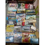 A Large Quantity of boxed Airfix car and plane model kits. Also includes various built cars.