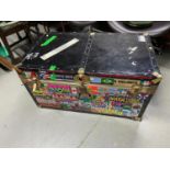 A Vintage travel trunk designed with a large collection of stickers from around the world.