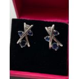 A Pair of unmarked white gold Sapphire and diamond earrings.