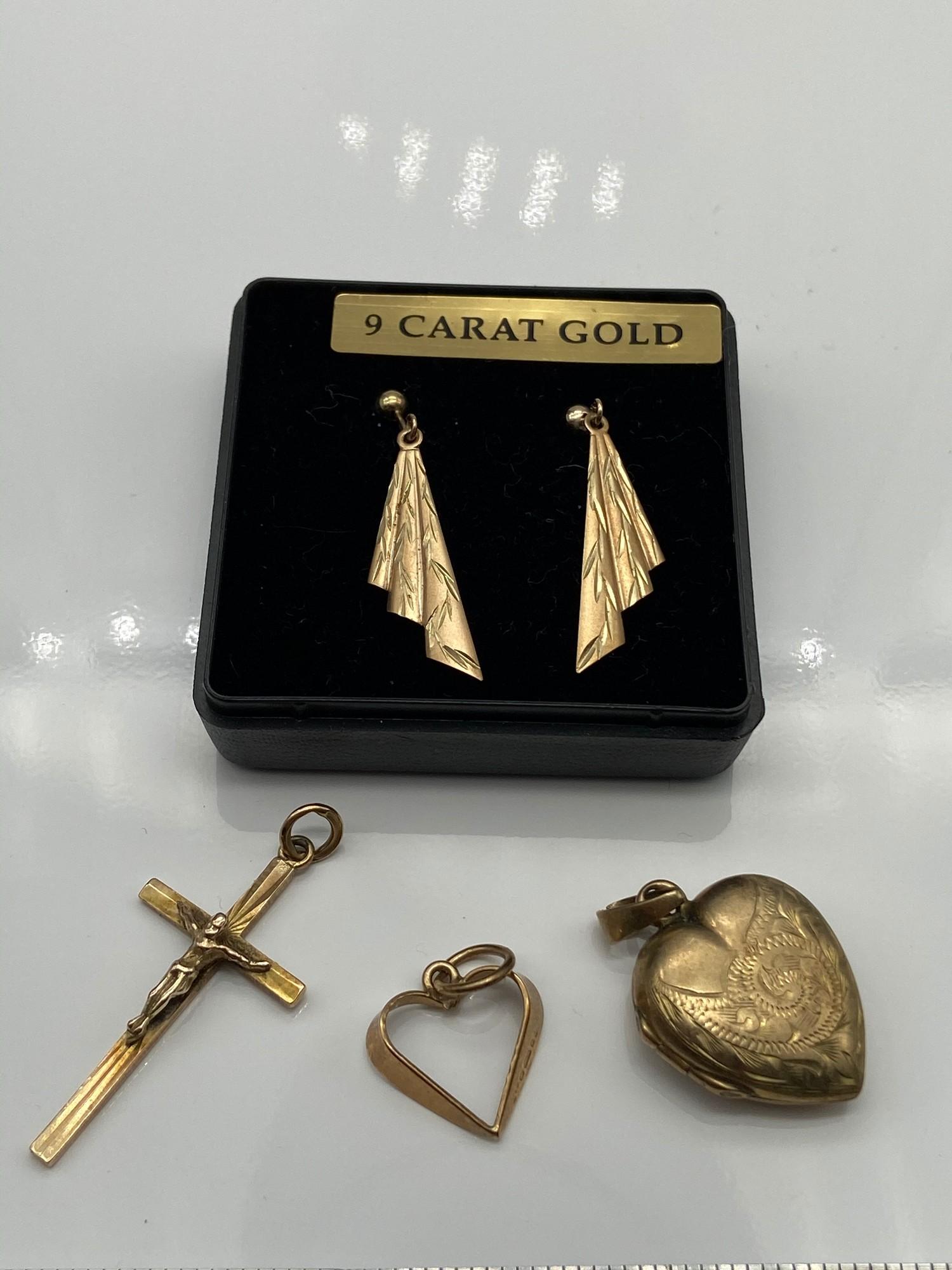 A Pair of 9ct gold earrings, A 9ct gold crucifix pendant, 9ct gold heart pendant and a 9ct gold back