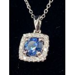 An 18ct white gold Sapphire and Diamond cluster pendant of 90 points. Comes with an 18ct white