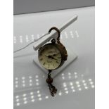 A Brass cased desk ball clock. In a working condition.