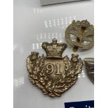 A Lot of three military cap badges which includes Glider Pilot Regiment.