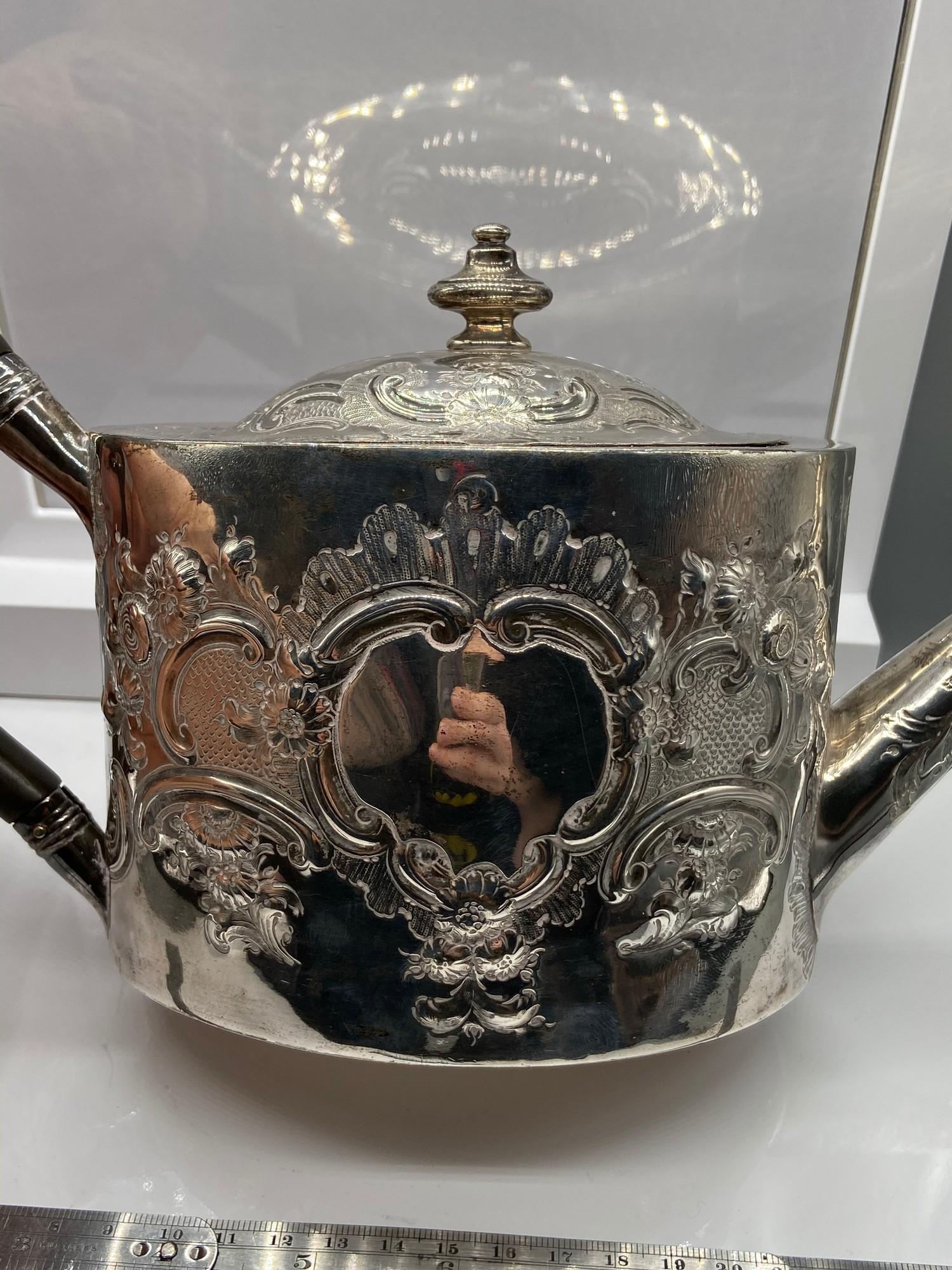 A Georgian London Silver ornate tea pot. Designed with a horn handle. Maker - George Burrows (I) - Image 6 of 7