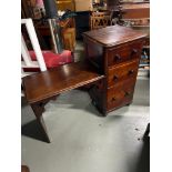A Late Victorian writing desk designed with three side drawers. Cross section back support and