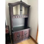 A Large Indian Rose wood display cabinet. Designed with ornate door panels, trims and finials. [