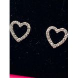 A Pair of 18ct white gold heart shaped diamond earrings.