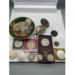 A quantity of mixed coins to include a collection of silver six pences, 1951 crown, 1846 Silver