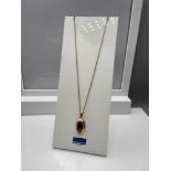 A 14ct Rolled Gold necklace and a 14ct rolled gold & amethyst pendant. [Chain 42cm length] [4 Grams]
