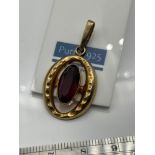 A 9ct gold ladies pendant with a large Amethyst stone. [3 Grams]