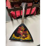 A Russian lacquered and hand painted Balalaika with three strings.