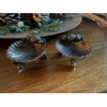A Pair of Victorian Birmingham silver shell design salts supported with three fish design stands.