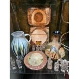A Shelf of studio pottery which includes studio pottery and figures, Includes a Troika large vase [