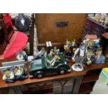 A Collection of Laurel and Hardy figurines which include car figurine, Book ends and clock etc