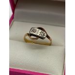 A ladies 18ct gold and Platinum Diamond ring. Designed with two diamonds. [Ring size K] [2 Grams]