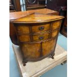 Antique corner cabinet designed on Queen Anne leg supports, two drawers and two door design.