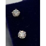 A Beautiful pair of 14ct white gold diamond stud earrings of 75 points. [0.88ct in total]