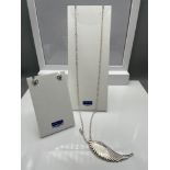 A 925 silver wing pendant and silver chain together with a pair of 925 silver heart shaped earrings.