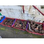 Four crates of various cast iron gutter and draining joints