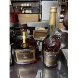 A Bottling of Hine V.S.O.P Fine Champagne Cognac . Together with a bottling of Martell V.S. Fine