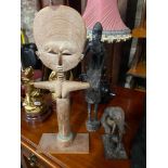 Three African Tribal hand carved wooden figures.