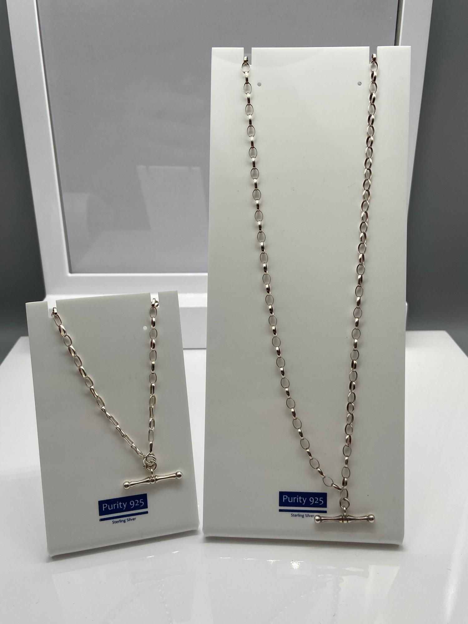 A 925 Silver curb chain necklace with fitted T-Bar together with a matching 925 silver bracelet. [