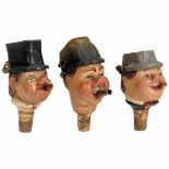 3 Musical Bottle Spouts, c. 1950Carved lime wood, depicting comical Bavarian characters. The tilting