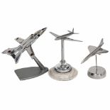 3 Aeroplane Models on Table StandsPolished aluminum. 1) De Havilland DH.106 Comet, 5 7/10 x 7 in.,