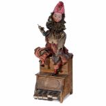 Rare Pedal-Operated Clown Musician Automaton, c. 1920sProbably Germany. Depicting a clown seated