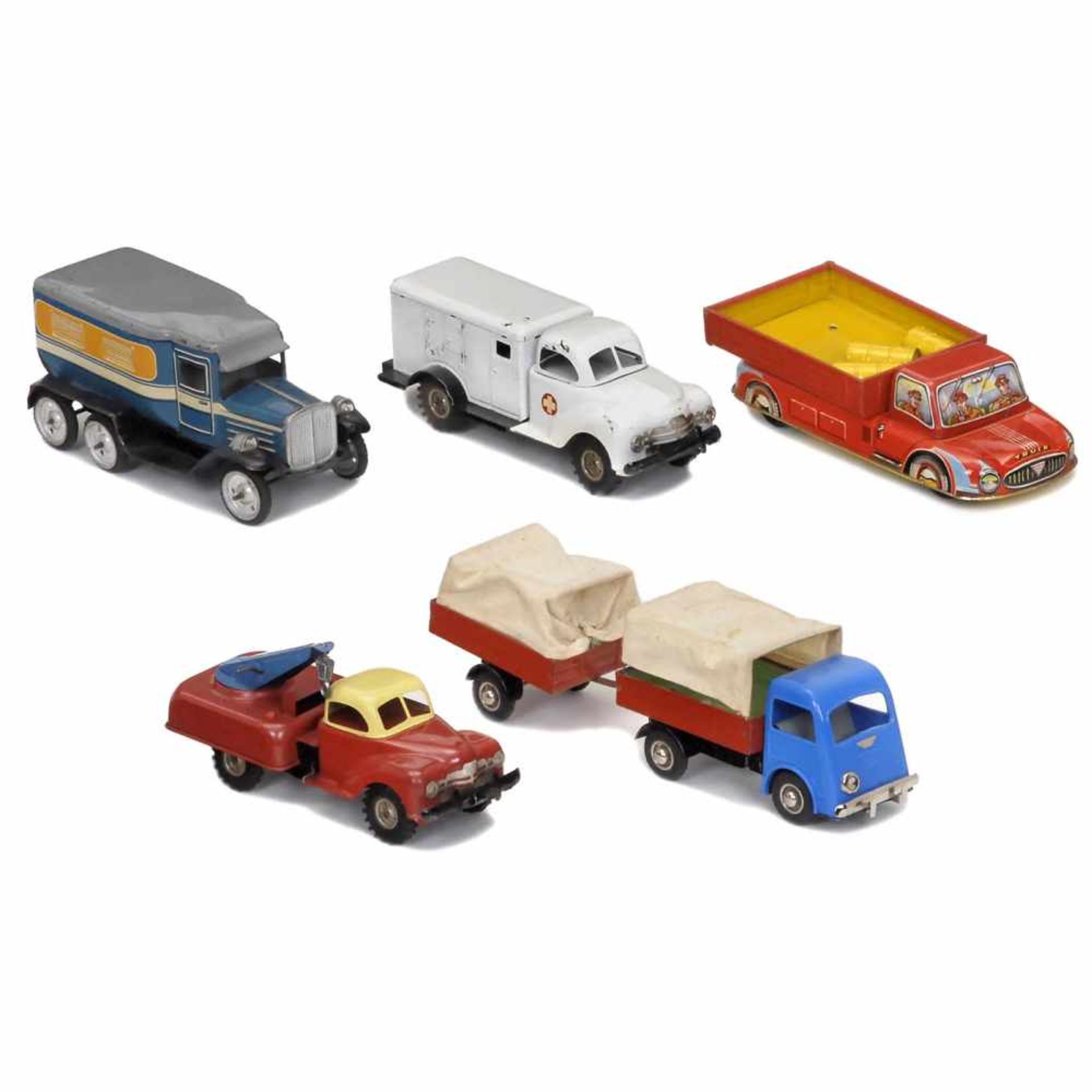 5 Tin-Toy Lorries, c. 1950-601) Gama, ambulance, U.S.-Zone Germany. Lacquered tin, friction drive (