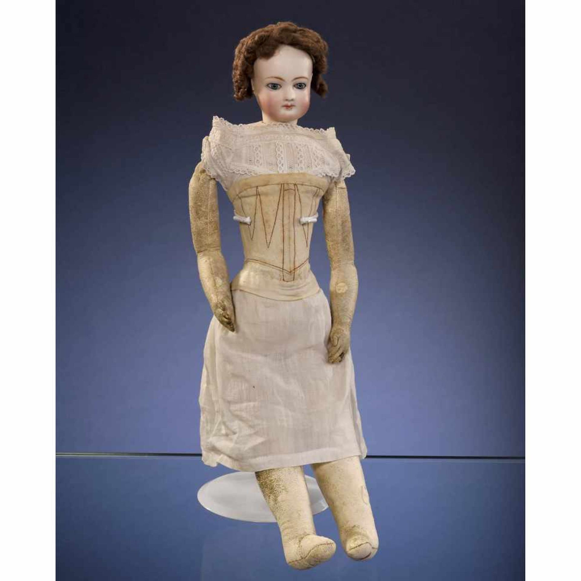 French Bisque Fashion Doll, c. 1870Probably by Jumeau. With pressed bisque swivel-head on