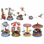 8 Kirmes-Karusselle und Zirkusspielzeuge, um 1950-70