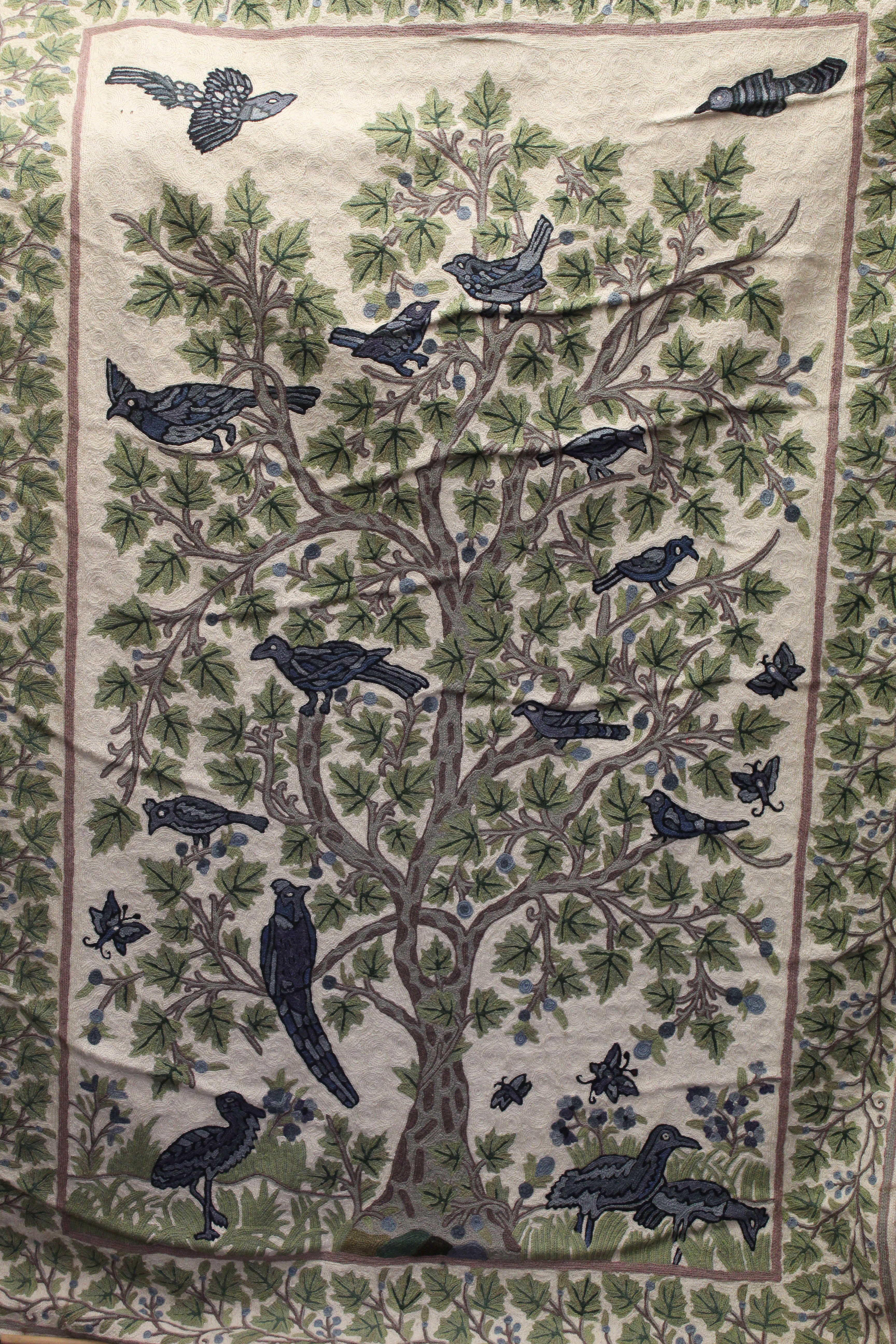 An Afghan woollen wall hanging, depicting the tree of life