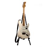 A Fender Stratocaster (2018) serial no MX18013313 cream contour body and plain maple neck. With