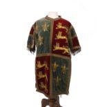 An early 20th century Medieval style tunic, in green and red velvet with gold lion emblems