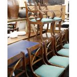 Eight mahogany dining chairs and two carvers, with green upholstered drop in seats in the Regency