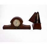 A mahogany cased metronome together with an oak mantle clock.