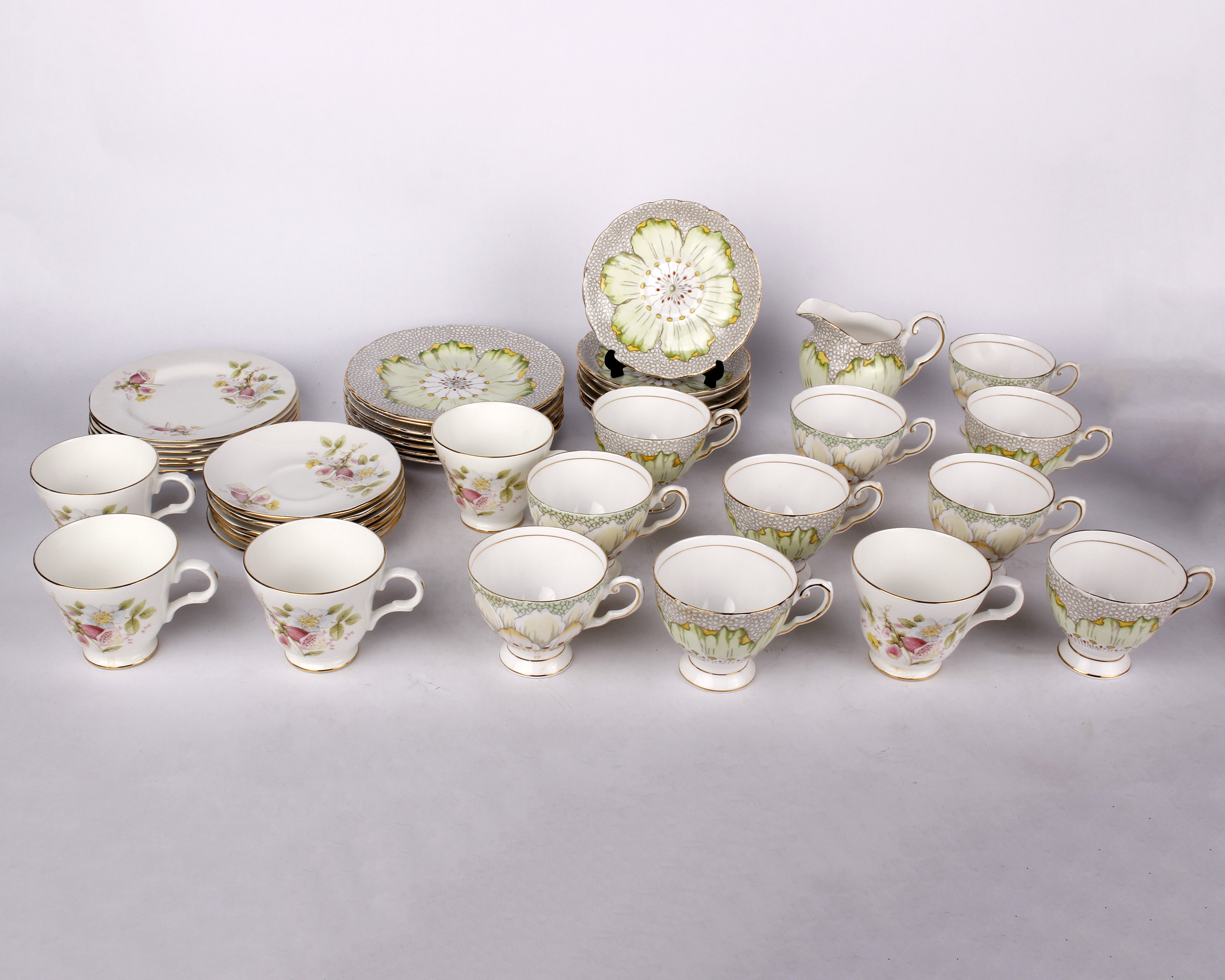 A Tuscan Fine Bone China tea set together with a Crown Trent part tea service.